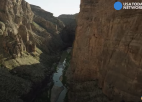 a canyon with a river running through it