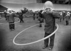young children use hoola-hoops.