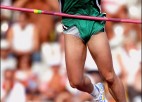 A pole vaulter with an expressive face.
