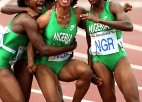 A Nigerian women's track relay team of four celebrates.