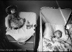 An AIDS-infected infant sleeps in a crib.