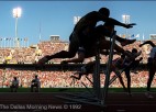 A silhouette of a group of hurdlers during an Olympic race.