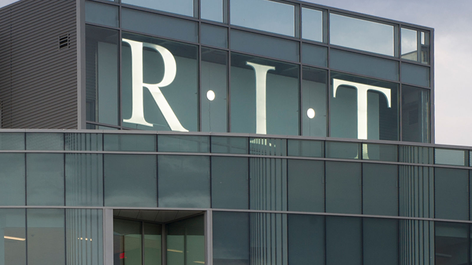 RIT Logo on top of Institute Hall