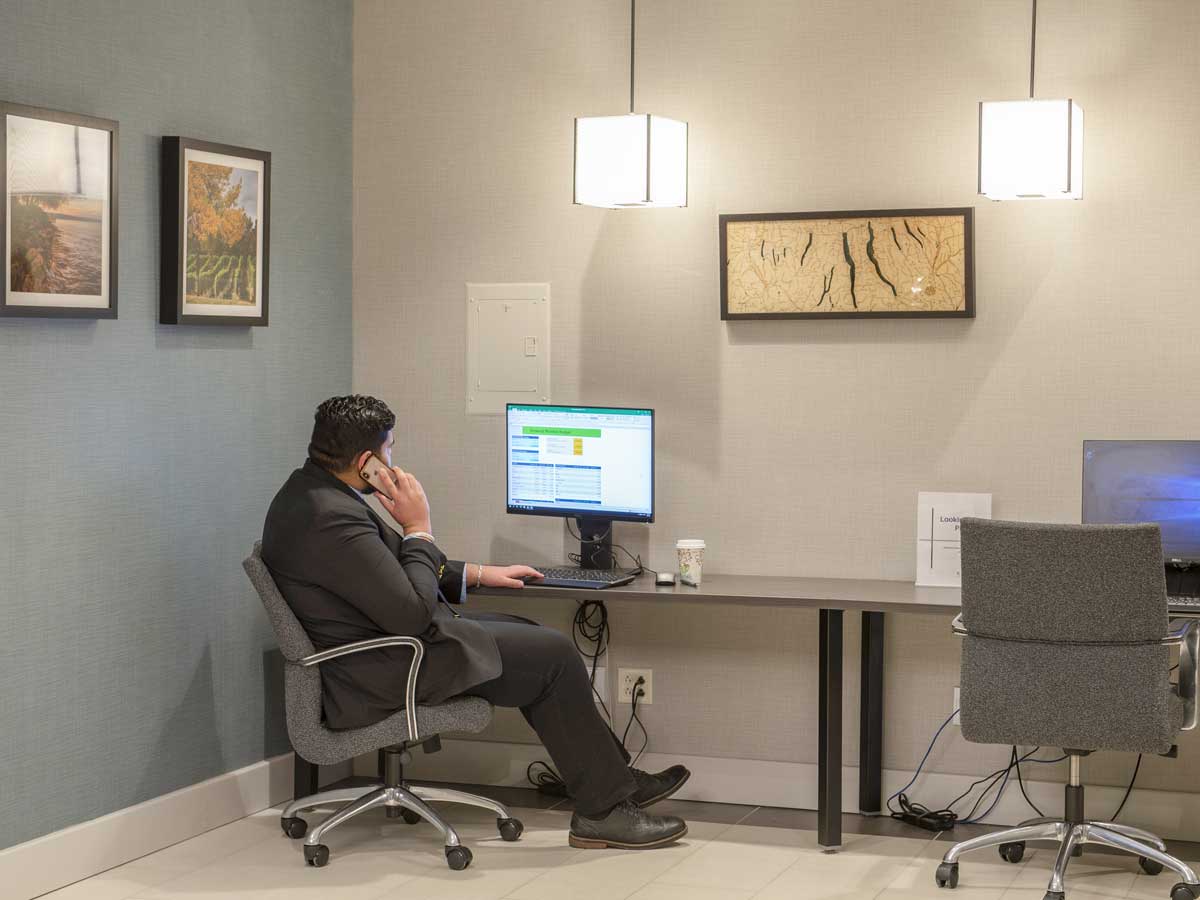 Man sitting at a bench with a computer