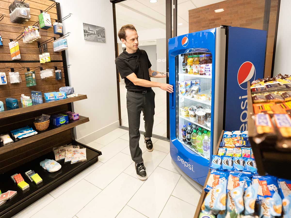 Convenient store with a beverage cooler and items on a shelf