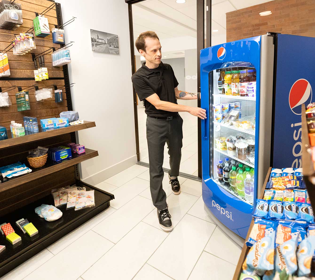 Beverage cooler and a shelf with snacks and toiletries 