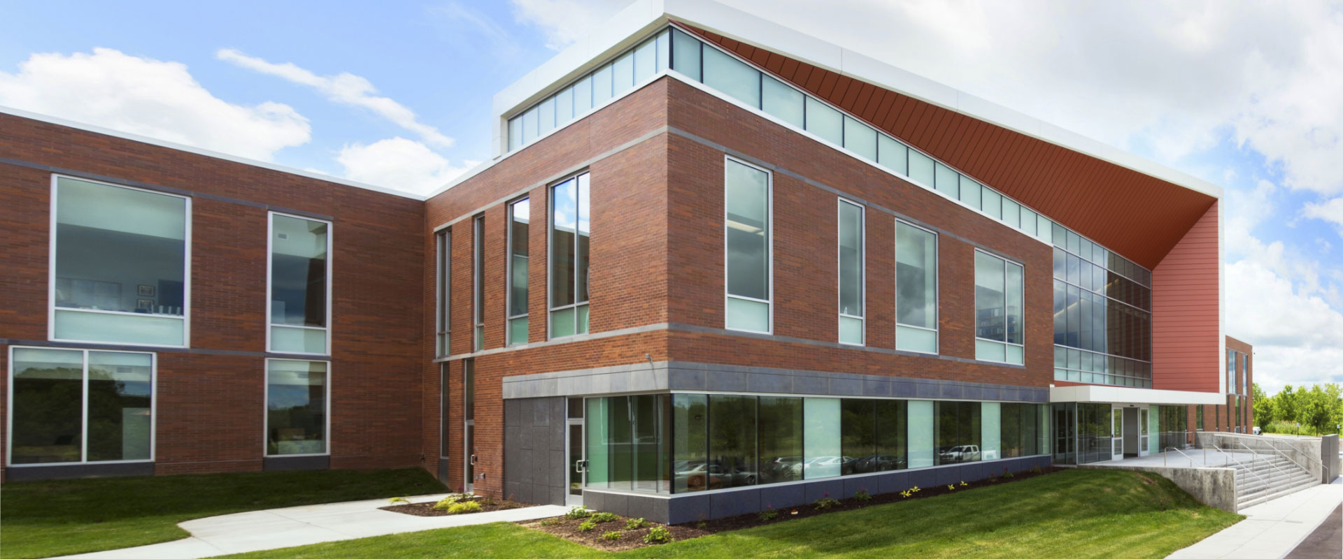 a large brick building with many glass windows