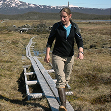 Carrie McCalley walking in a field