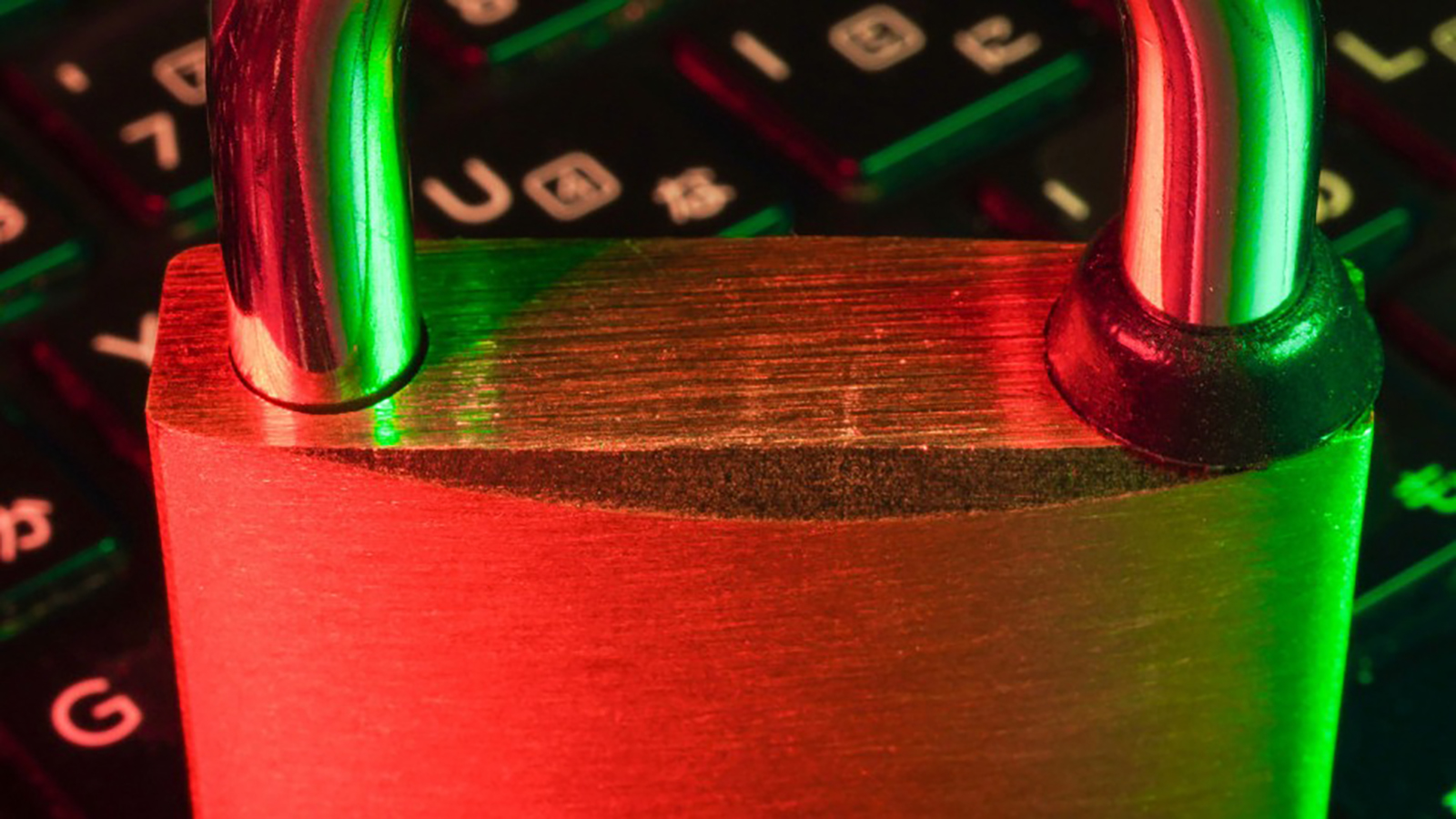 A laptop with a padlock resting on the keyboard.