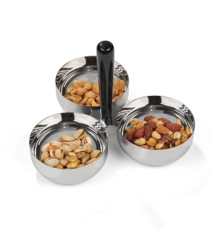 a sleek, modern stainless steel serving bowl divided in tree equal sections filled with nuts and a straight black handle coming out of the center.