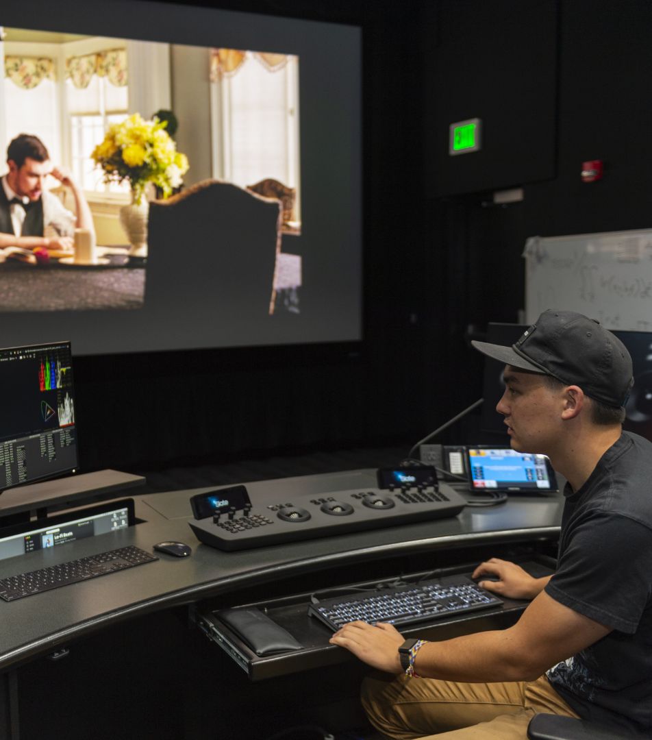 Person in a studio editing a film