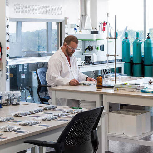 A researcher in a lab in the Golisano Institute for Sustainability.