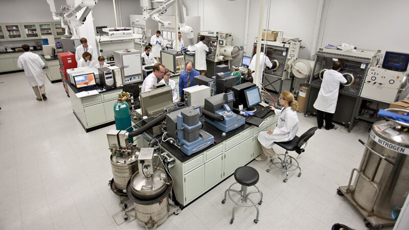 students and faculty members in a lab