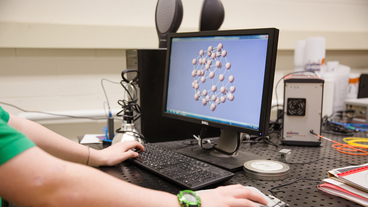 Close up of a person working on a computer.