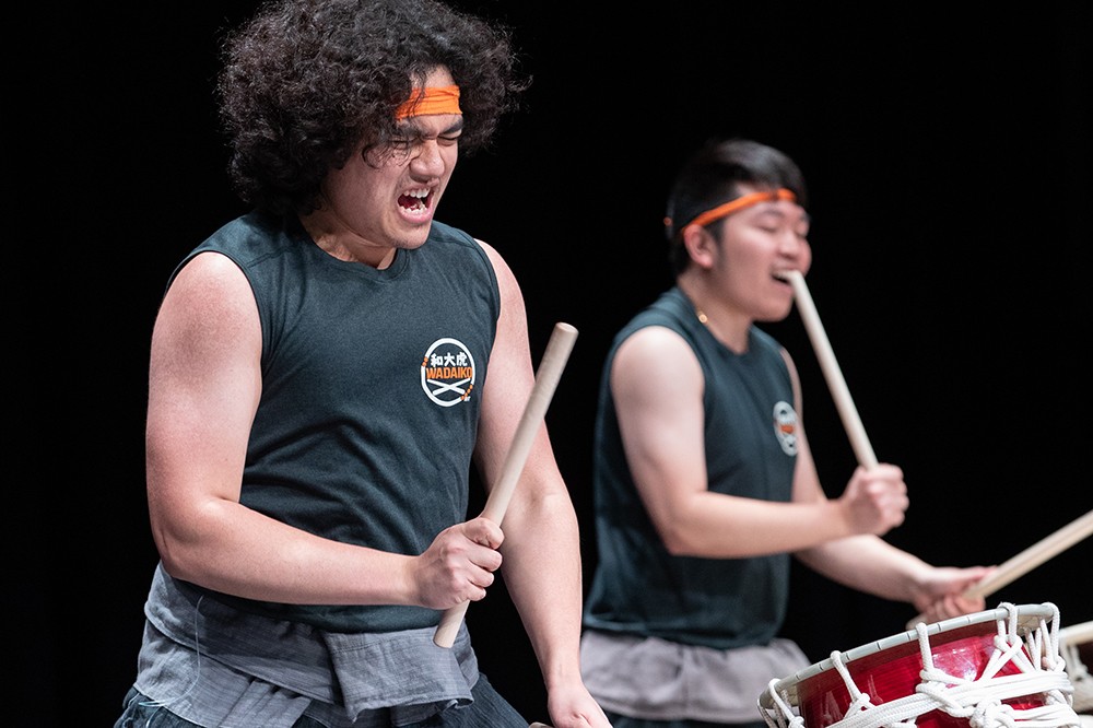 two males drumming