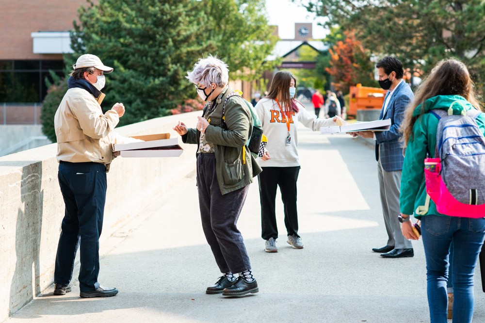 Students get free cookies on quarter mile on fall day