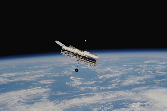 The Hubble Space Telescope is shown in space after deployment on its second servicing mission.