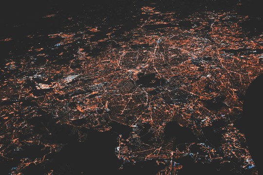 an image of lights across the globe depicting a global IT network.
