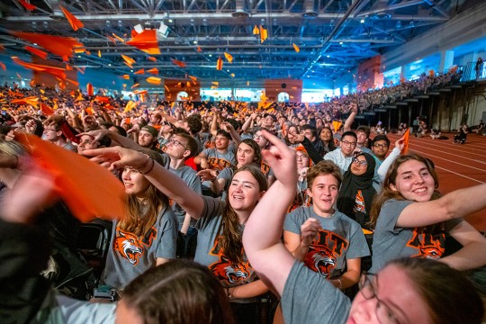 Students throw paper planes with their dreams to end the Fall Convocation for New Students 