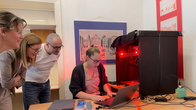 Izzy Moyer works at a laptop analyzing images.