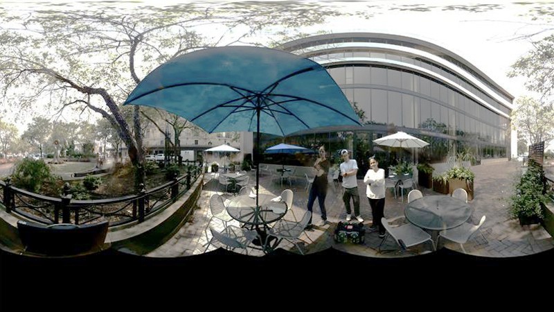 Anjali standing outside with some co-workers