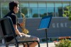student playing the saxophone outside.