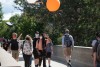 students walking on Quarter Miles wearing masks.