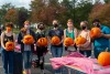 Group of students pose with carved pumpkins