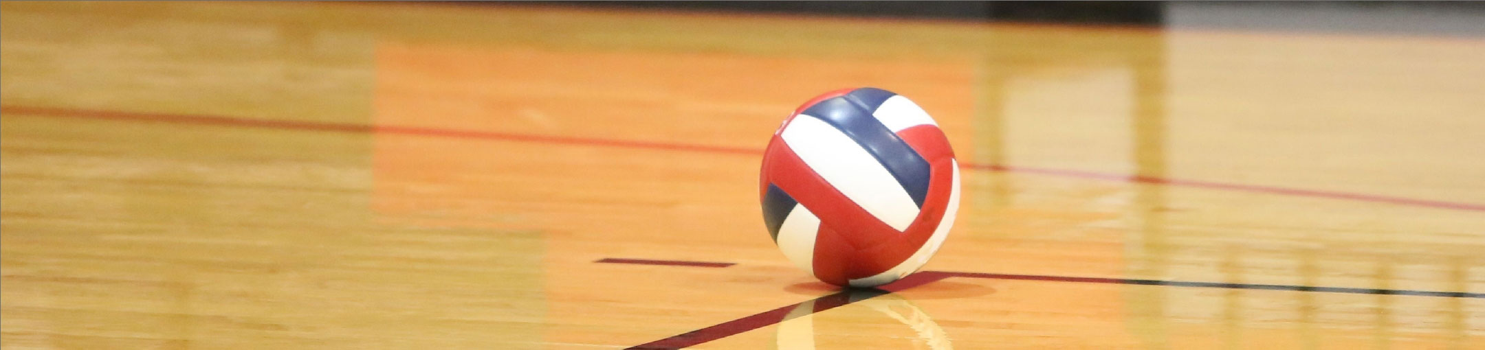 a volleyball sitting on a basketball court