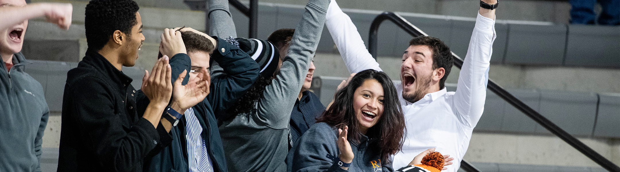 Students cheering for an RIT hockey goal