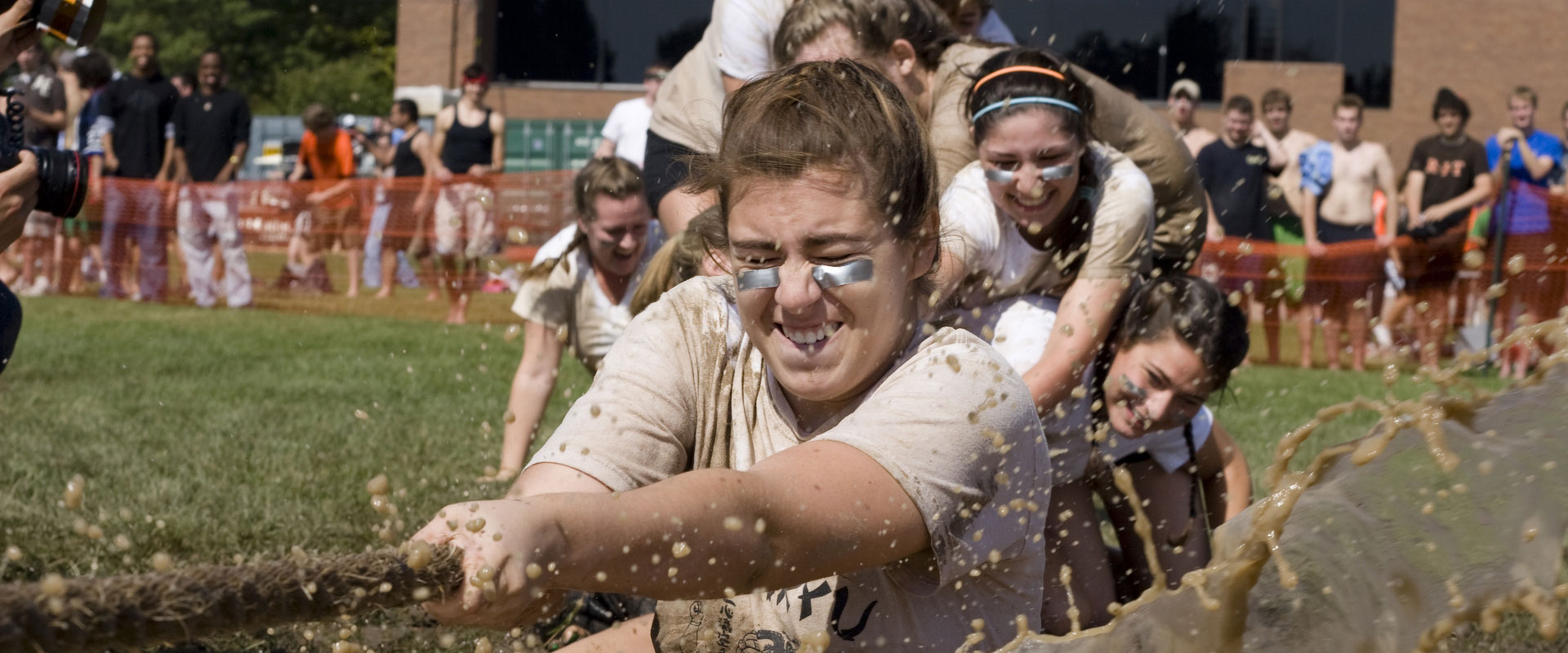 An team being pulled into the mud at mudtug