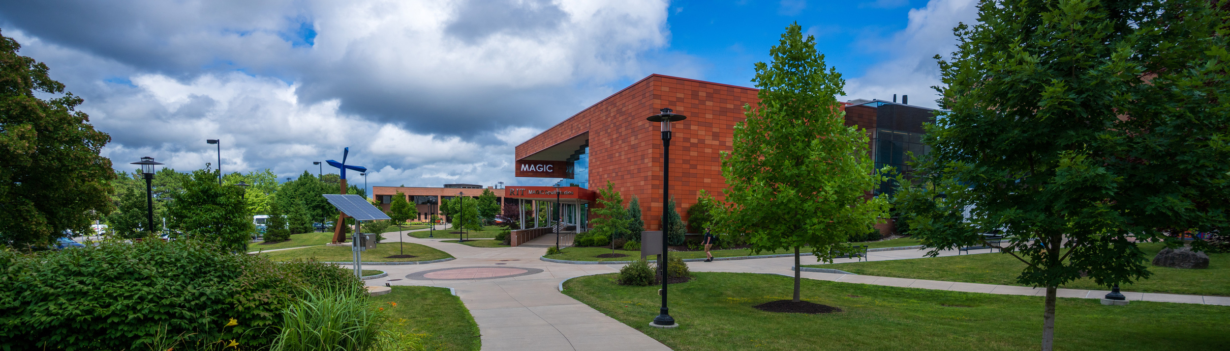 MAGIC spell studio panoramic shot sidewalks trees blue skies fluffy clouds