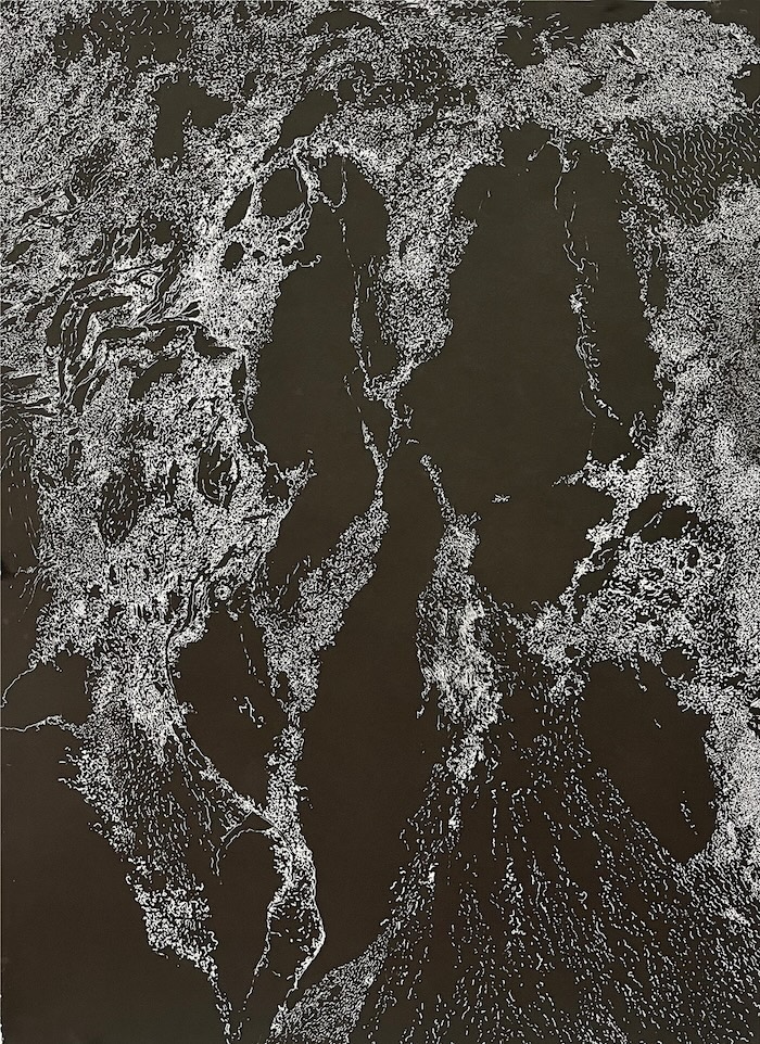 an abstract white ink on black paper drawing that resembles a satellite image of the earth from space.