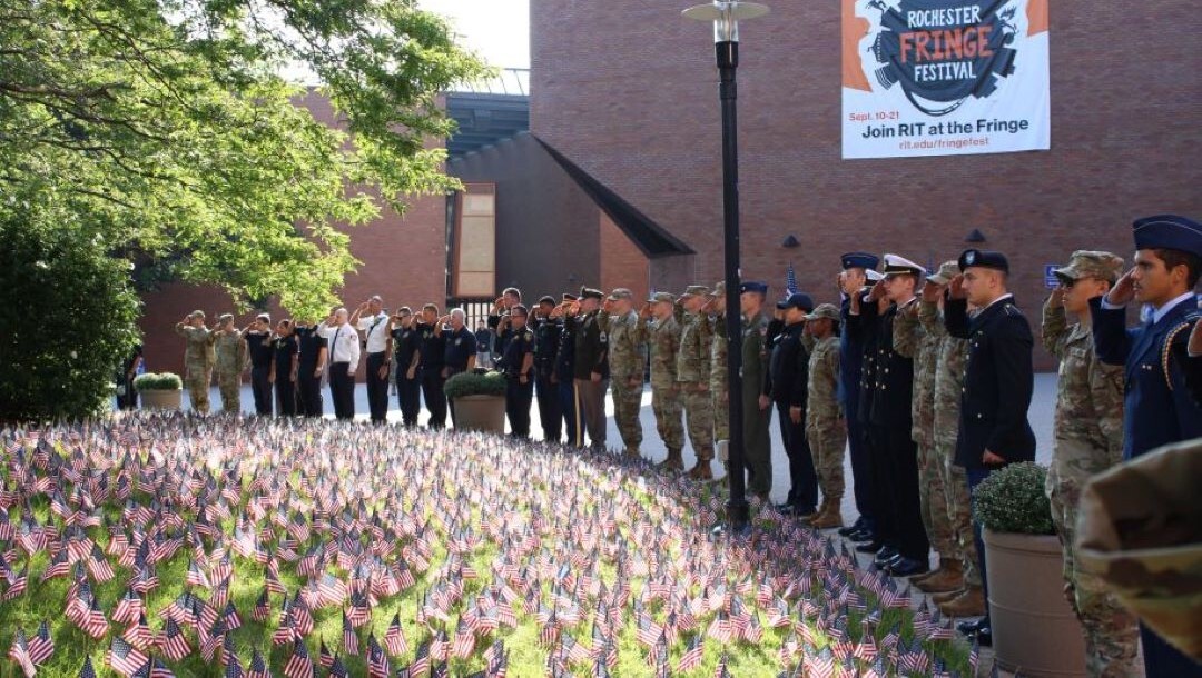 cadets, service members, and community members standing vigil for 9/11 memorial